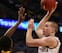 CHICAGO, IL - MARCH 15: Matt Costello #10 of the Michigan State Spartans shoots against Gabriel Olaseni #0 of the Iowa Hawkeyes during a quarterfinal game of the Big Ten Basketball Tournament at the United Center on March 15, 2013 in Chicago, Illinois. (P