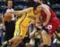 Luis Scola muscles his way into the lane against the Chicago Bulls' Erik Murphy on Oct. 5.