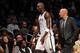 Jason Kidd sees Kevin Garnett to the bench.