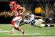 Kenny Vaccaro stretches out to make a tackle