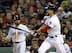 Ellsbury is rung up as Victorino looks on.
