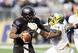 Oregon DE DeForest Buckner tries to bring down QB Keith Price