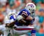 MIAMI GARDENS, FL - OCTOBER 20: T.J. Graham #11 of the Buffalo Bills (R) is tackled by Dimitri Patterson #24 (L) of the Miami Dolphins at Sun Life Stadium on October 20, 2013 in Miami Gardens, Florida. (Photo by Chris Trotman/Getty Images)