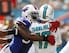 Oct 20, 2013; Miami Gardens, FL, USA; Miami Dolphins quarterback Ryan Tannehill (17) is pressured by Buffalo Bills defensive end Mario Williams (94) in the first quarter of a game at Sun Life Stadium. Mandatory Credit: Robert Mayer-USA TODAY Sports