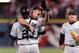 Brown celebrates his no-hitter with catcher Charles Johnson with Conine eager to join in the background.