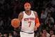Carmelo Anthony dribbling up the court at the new MSG