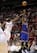 J.R. Smith shoots over a lunging James Harden
