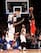 Chris Paul with the floater over Amar'e Stoudemire and J.R. Smith