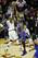 Kyrie Irving shooting over the finger tips of Raymond Felton