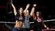 A.J. Lee celebrates with Tamina Snuka on Raw
