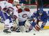 Montreal Canadiens goalie Peter Budaj with Habs forward Michael Bournival and New York Rangers forward Derick Brassard.
