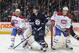 Montreal Canadiens defensemen Francis Bouillon (left) and Nathan Beaulieu (right) flanking Winnipeg Jets forward Mark Scheifele.