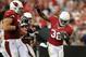 Andre Ellington (right) celebrates a touchdown.