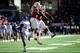 Chris Whaley (right) celebrates his second return touchdown of the season.