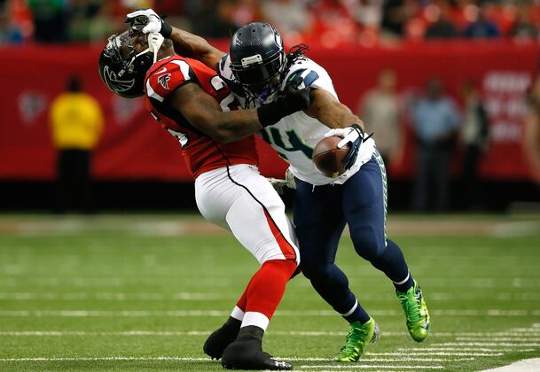 hi-res-187601845-marshawn-lynch-of-the-seattle-seahawks-stiff-arms_crop_north.jpg