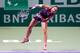 Sara Errani serves at the 2013 WTA Championships.