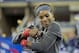 Serena Williams hugs trophy after winning 2013 U.S. Open.