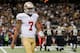 Colin Kaepernick walks off the field after San Francisco's loss to New Orleans.