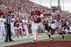 Knight (center) has really opened up the Sooners rushing attack.