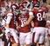 Holder Matthew Emrich (left), kicker Zach Hocker (center) and tight end Hunter Henry (right) celebrate a successful kick against Texas A&M.