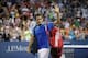 Roger Federer waves to the crowd as he leaves the court at the 2013 U.S. Open.