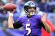 BALTIMORE, MD - NOVEMBER 24: Quarterback Joe Flacco #5 of the Baltimore Ravens throws a first half pass against the New York Jets at M&T Bank Stadium on November 24, 2013 in Baltimore, Maryland. (Photo by Rob Carr/Getty Images)