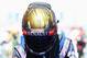 Vettel celebrates winning the German Grand Prix wearing the helmet that fetched £58,000