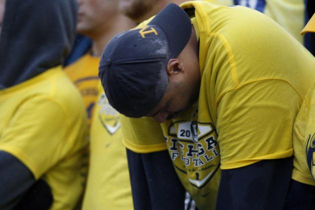hi-res-77963038-michigan-wolverines-fan-reacts-to-a-14-3-loss-to-the_crop_north.jpg
