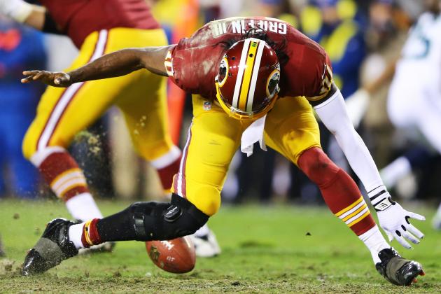 Robert Griffin III with an American football between his legs. 