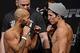Flyweight champion Demetrious Johnson (left) and Joseph Benavidez fought Saturday for the strap.