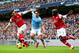 Giroud (left) fights for the ball.