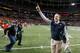 Malzahn (right) is only headed up.