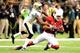 Saints cornerback Keenan Lewis runs down Cardinals wide receiver Larry Fitzgerald.