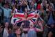 LONDON, ENGLAND - JULY 05: Spectators celebrate Andy Murray of Great Britain's win in the men's singles semi final match against Jerzy Janowicz of Poland on day eleven of the Wimbledon Lawn Tennis Championships at the All England Lawn Tennis and Croquet