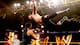 Sami Zayn soars at Leo Kruger.