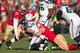 49ers outside linebacker Aldon Smith (No. 99) looks on as Justin Smith sacks Seahawks quarterback Russell Wilson.