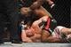 Rashad Evans (top) earned TKO of Chael Sonnen at UFC 167.