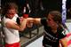 Jessica Andrade (right) punches Rosi Sexton.