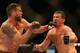 Ryan Bader (left) punches Anthony Perosh at UFC Fight Night 33