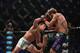Michael Chandler (left) punches David Rickels at Bellator 97.