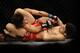 Kang attempts a triangle choke in Round 1.