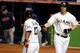 Donovan Solano, left, and Ed Lucas could play pivotal roles as utility players with the Miami Marlins in 2014.