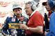 Economaki, right, interviews Dale Earnhardt.