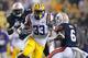 Jeremy Hill shook off a tackle from Auburn's Jonathon Mincy to break a 49-yard touchdown run for the opening touchdown score of the game.