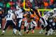 Miller dives to block a pass from Ryan Fitzpatrick.