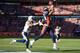 Thomas snares a touchdown grab against the Chargers.