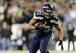 Dec 2, 2013; Seattle, WA, USA; Seattle Seahawks defensive end Michael Bennett (72) runs the ball in for a touchdown after recovering the fumble by New Orleans Saints quarterback Drew Brees (not pictured) during the 1st quarter at CenturyLink Field. Mandat