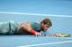 Ryan Harrison hits the ground at 2014 Australian Open.