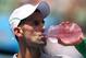 Novak Djokovic stays hydrated ahead of week 2 of the Australian Open.