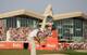 With the Abu Dhabi clubhouse falcon looking on as a player chips to the 18th green.